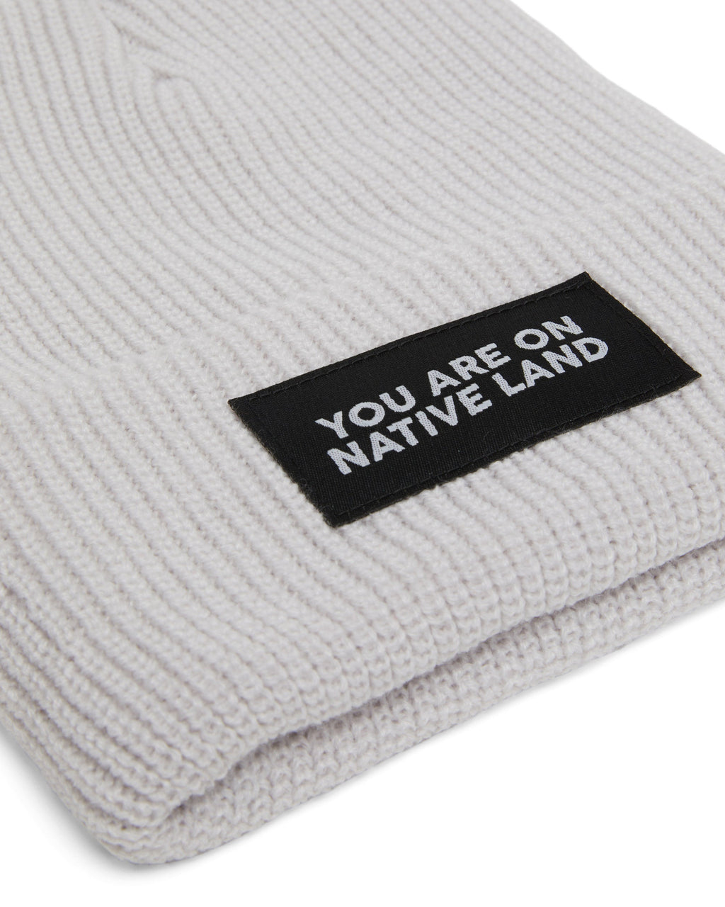 'YOU ARE ON NATIVE LAND' RIBBED BEANIE